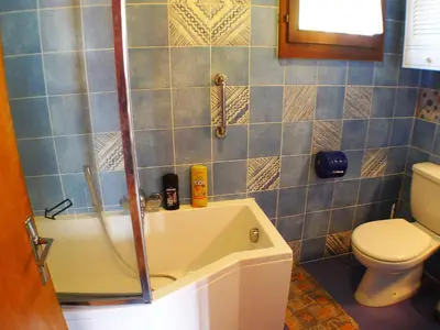 a bathroom with a shower and a sink and a toilet at Chalet familial calme proche centre, 8 pers, WiFi, garage - FR-1-629-103 in Samoëns