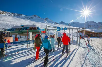 a group of people on skis at a ski lift at La Maisonnée de Julie - Happy Rentals in Chamonix-Mont-Blanc