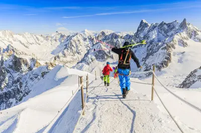 a group of people walking up a snow covered mountain at La Maisonnée de Julie - Happy Rentals in Chamonix-Mont-Blanc