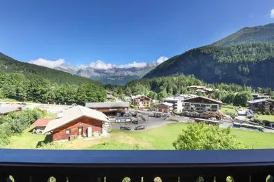 a view of a village with mountains in the background at Prarion ski in ski out and swimming pool ! in Les Houches