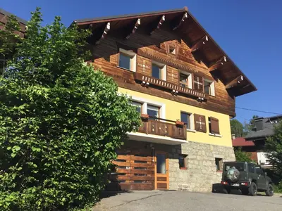 a large wooden building with a balcony on it at Chalet Mirador appartement vue panoramique SITUÉ À 25 kms de CHAMONIX in Saint-Gervais-les-Bains