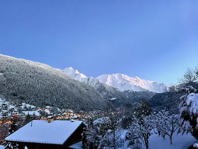a town in a valley covered in snow with mountains at Chalet Mirador appartement vue panoramique SITUÉ À 25 kms de CHAMONIX in Saint-Gervais-les-Bains