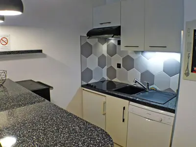 a kitchen with a sink and a counter top at Confortable 3 pièces avec terrasse, idéal pour 6 personnes - FR-1-629-100 in Samoëns