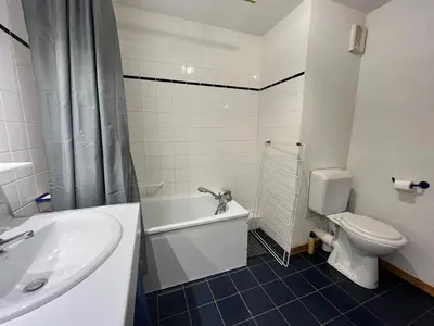 a bathroom with a tub and a toilet and a sink at Appartement lumineux au pied des pistes avec accès direct Grand Massif - FR-1-624-100 in Morillon