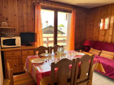 a dining room with a table and a window at Résidence Coupe De Cristal - Coupe de Cristal A6 MAE-6544 in Saint-Gervais-les-Bains