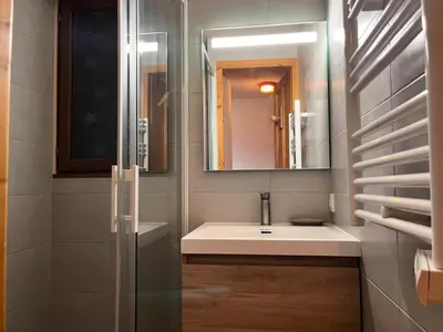 a bathroom with a sink and a mirror at Résidence Coupe De Cristal - Coupe de Cristal A6 MAE-6544 in Saint-Gervais-les-Bains