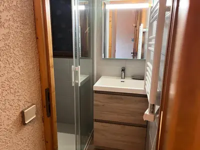 a bathroom with a shower and a sink and a mirror at Résidence Coupe De Cristal - Coupe de Cristal A6 MAE-6544 in Saint-Gervais-les-Bains