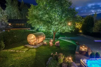 an overhead view of a backyard with a tree and a boat at Chalet Tissières in Chamonix-Mont-Blanc