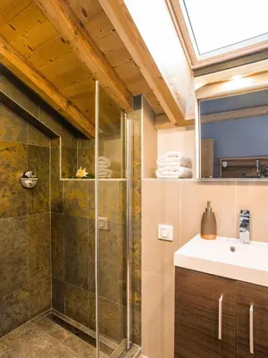 a bathroom with a shower and a sink at Chalet Rubicon in Les Houches
