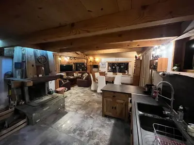 a kitchen and living room in a house at CHALET TOUDBIOLE haut de chalet in Les Houches