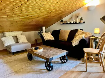 a living room with a couch and a coffee table at Appartement familial avec piscines à Samoëns - FR-1-624-103 in Samoëns