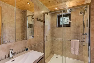 a bathroom with a shower and a sink at Apartment Cry - Alpes Travel - Central Chamonix (sleeps 2-4) in Chamonix-Mont-Blanc