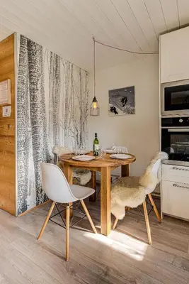 a dining room with a table and two chairs at Apartment Cry - Alpes Travel - Central Chamonix (sleeps 2-4) in Chamonix-Mont-Blanc