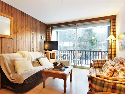 a living room with a couch and a table at Apartment Arve 1 et 2-4 by Interhome in Chamonix-Mont-Blanc