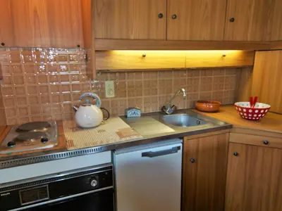 a kitchen with a sink and a counter top at Apartment Alpen Roc by Interhome in Chamonix-Mont-Blanc