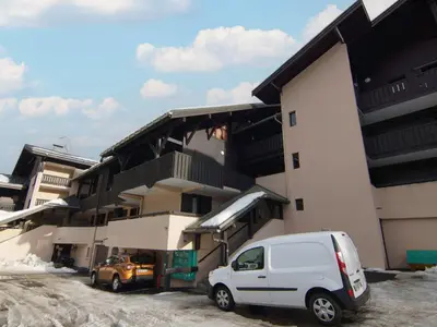 a white van parked in front of a building at Studio Les Arandellys by Interhome in Les Houches