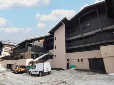 a white van parked in front of a building at Studio Les Arandellys by Interhome in Les Houches