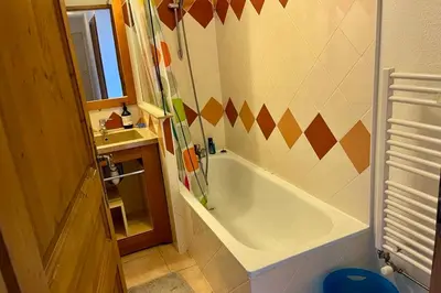 a bathroom with a tub and a sink at Apartment Of 55 M With Balcony View Mont Blanc in Chamonix-Mont-Blanc