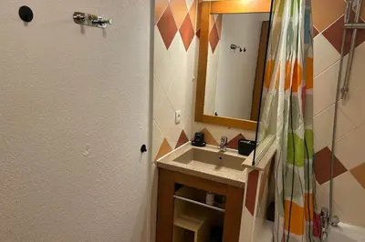 a bathroom with a sink and a mirror and a shower at Apartment Of 55 M With Balcony View Mont Blanc in Chamonix-Mont-Blanc