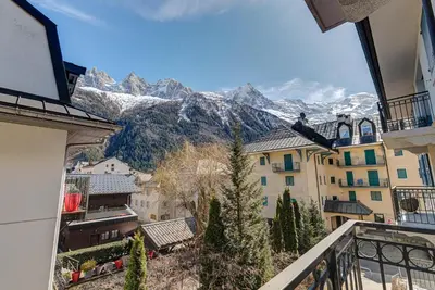 a view of the mountains from the balcony of a house at APARTMENT LE PARADIS 2 - ALPES TRAVEL - CENTRAL CHAMONIX (sleeps4-5) in Chamonix-Mont-Blanc