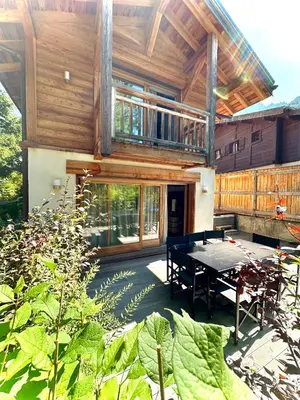 a house with a ping pong table in a garden at chalet Polar in Chamonix-Mont-Blanc