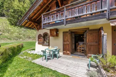 a living room with red furniture and a fireplace at Chalets d'Henri 67 - Happy Rentals in Chamonix-Mont-Blanc