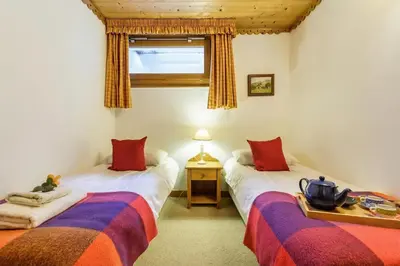 a ski slope with a ski lift in the snow at Chalets d'Henri 67 - Happy Rentals in Chamonix-Mont-Blanc