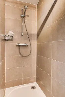 a bathroom with a shower with a tub at Apartment Fermes du Montenvers B11 - Alpes Travel - Central Chamonix - sleeps 4 in Chamonix-Mont-Blanc