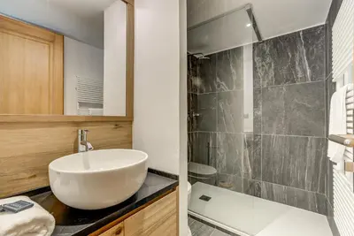 a bathroom with a sink and a shower at Pic Janvier - Alpes Travel - Les Praz (sleeps 4-6) in Chamonix-Mont-Blanc