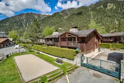 an aerial view of a house with mountains in the background at Pic Janvier - Alpes Travel - Les Praz (sleeps 4-6) in Chamonix-Mont-Blanc