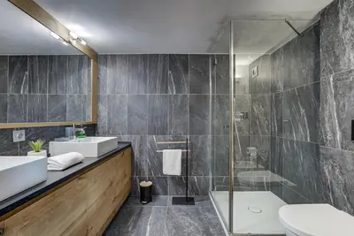 a bathroom with a sink and a shower at Pic Janvier - Alpes Travel - Les Praz (sleeps 4-6) in Chamonix-Mont-Blanc