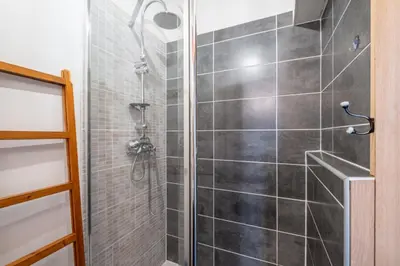 a bathroom with a white sink and a mirror at Warm Haven in Chamonix With balcony in Chamonix-Mont-Blanc