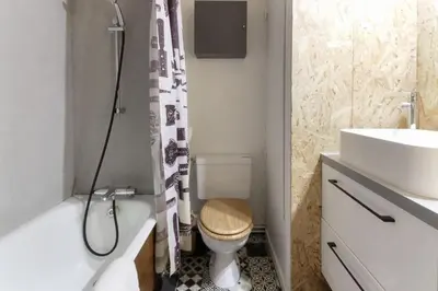 a bathroom with a toilet and a sink and a shower at Les Dryades - Rénové - Balcon avec vue Mt Blanc in Les Houches