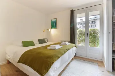 a bedroom with a bed and a window at Les Gaillands in Chamonix-Mont-Blanc