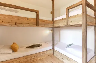 a room with two bunk beds and a tub at Les Gaillands in Chamonix-Mont-Blanc