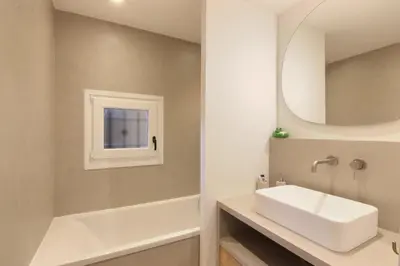 a bathroom with a white sink and a mirror at Les Gaillands in Chamonix-Mont-Blanc