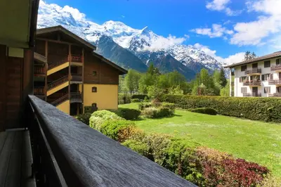 a balcony with a view of a mountain at Les Capucins - Calm - Mont-Blanc - Lake Gaillland in Chamonix-Mont-Blanc