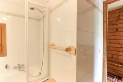 a bathroom with a shower with a glass door at Les Capucins - Calm - Mont-Blanc - Lake Gaillland in Chamonix-Mont-Blanc