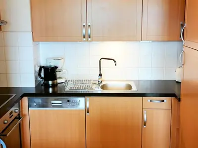 a living room with a table and a couch at T4 à Morillon 1100 avec Wifi et Animaux acceptés - FR-1-815-79 in Morillon