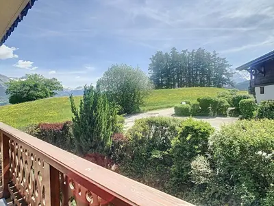 a balcony with a table and chairs on it at Appartement 2 pièces + cabine à proximité du village et téléski, cuisine équipée - FR-1-560-89 in Combloux