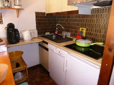 a small kitchen with a sink and a stove at Résidence Mont'seu - Mont'seu C401 MAE-6354 in Les Contamines-Montjoie