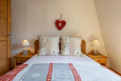 a living room with a couch and a tv at Chateau - Charming Apartment in the city Center with 3 bedrooms - By Cozee Rentals in Saint-Gervais-les-Bains