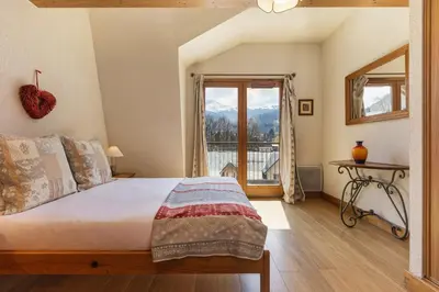 a balcony with a view of a city at Chateau - Charming Apartment in the city Center with 3 bedrooms - By Cozee Rentals in Saint-Gervais-les-Bains