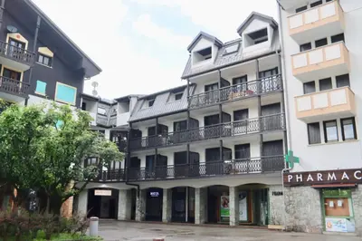 an apartment building with balconies on the side of it at Chamonix Sud studio with Mont Blanc views in Chamonix-Mont-Blanc