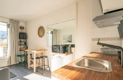 a kitchen with a stainless steel sink and a counter at Chamonix Sud studio with Mont Blanc views in Chamonix-Mont-Blanc