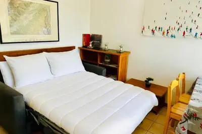 a small kitchen with a sink and a microwave at Nice Apt With Balcon In The Downtown ! in Chamonix-Mont-Blanc