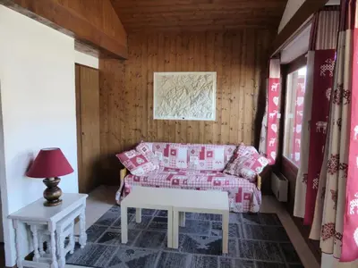 a living room with a couch and a table at Résidence Princesse En Etraz Narcisse - Princesse en Etraz N34 MAE-2284 in Combloux