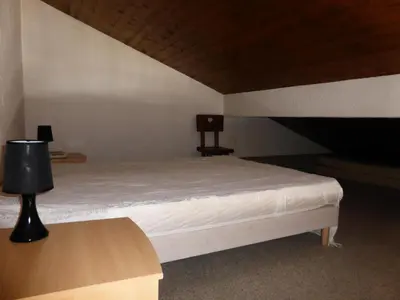 a bedroom with a bed and a table with a lamp at Résidence Princesse En Etraz Narcisse - Princesse en Etraz N34 MAE-2284 in Combloux
