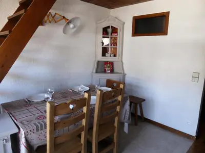 a dining room with a table and some chairs at Résidence Princesse En Etraz Narcisse - Princesse en Etraz N34 MAE-2284 in Combloux