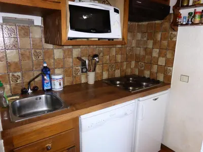 a kitchen counter with a sink and a microwave at Résidence Princesse En Etraz Narcisse - Princesse en Etraz N34 MAE-2284 in Combloux